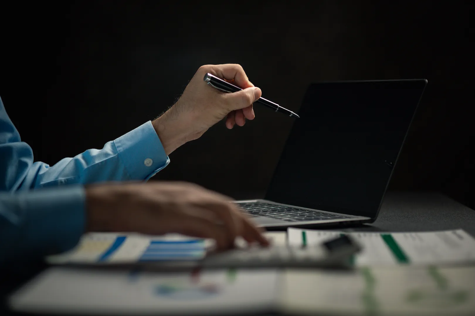Campaign planning with laptop and performance notes